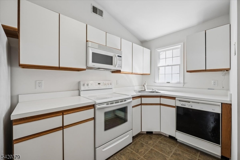 20 Alexandria Way Bernards, NJ 07920 - Photo 13 of 26 a kitchen with cabinets stainless steel appliances and sink