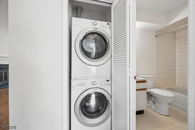 20 Alexandria Way Bernards, NJ 07920 - Photo 14 of 26 a view of a bathroom with a washer and dryer