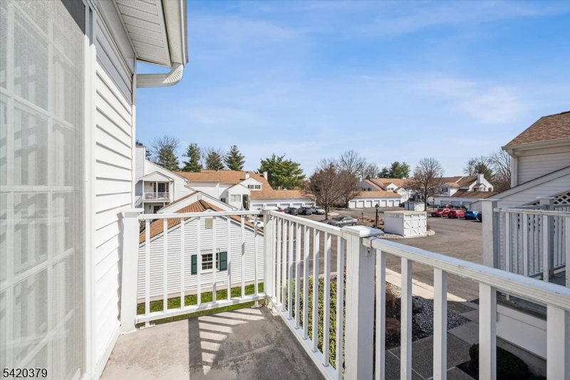 20 Alexandria Way Bernards, NJ 07920 - Photo 22 of 26 a view of a house with a small yard and wooden fence