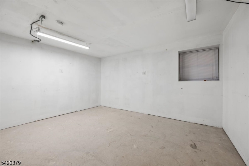 20 Alexandria Way Bernards, NJ 07920 - Photo 24 of 26 an empty room with a workbench