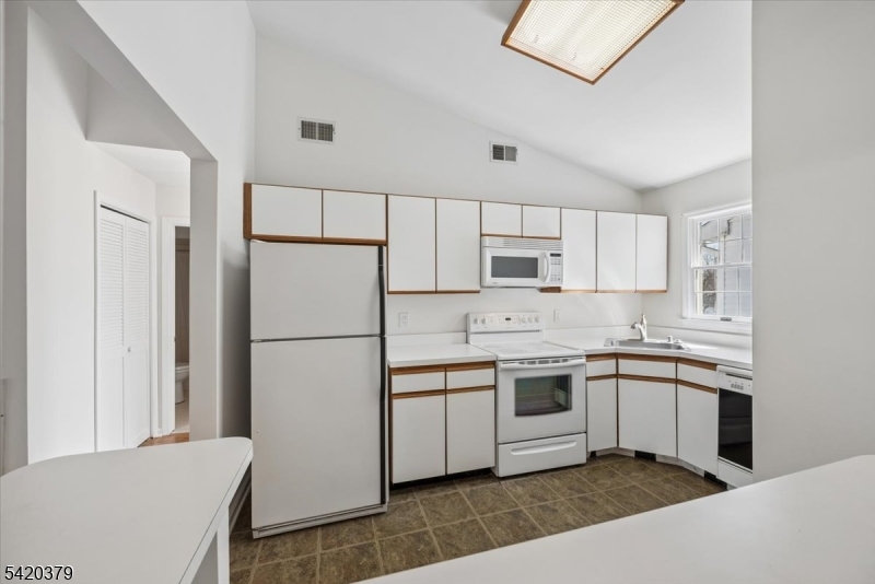 20 Alexandria Way Bernards, NJ 07920 - Photo 10 of 26 a kitchen with stainless steel appliances granite countertop a refrigerator sink and cabinets