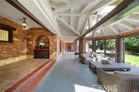 a living room with furniture and flowers