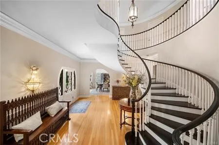 a view of entryway livingroom and hall with wooden floor