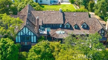 a view of a house with a flower garden