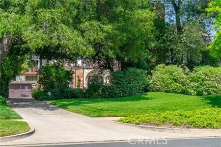 a view of a building with a yard