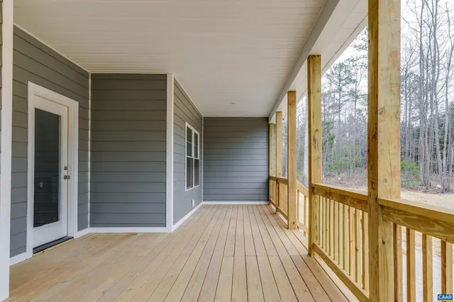 a view of a balcony with wooden floor