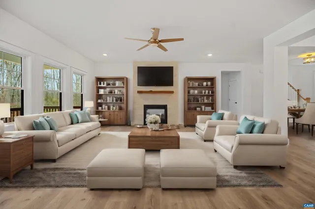 a living room with fireplace furniture and a flat screen tv