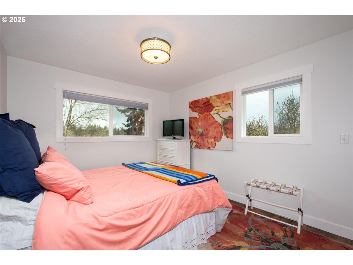 10339 Southwest 40th Avenue Portland, OR 97219 - Photo 20 of 37 a bedroom with a bed and window