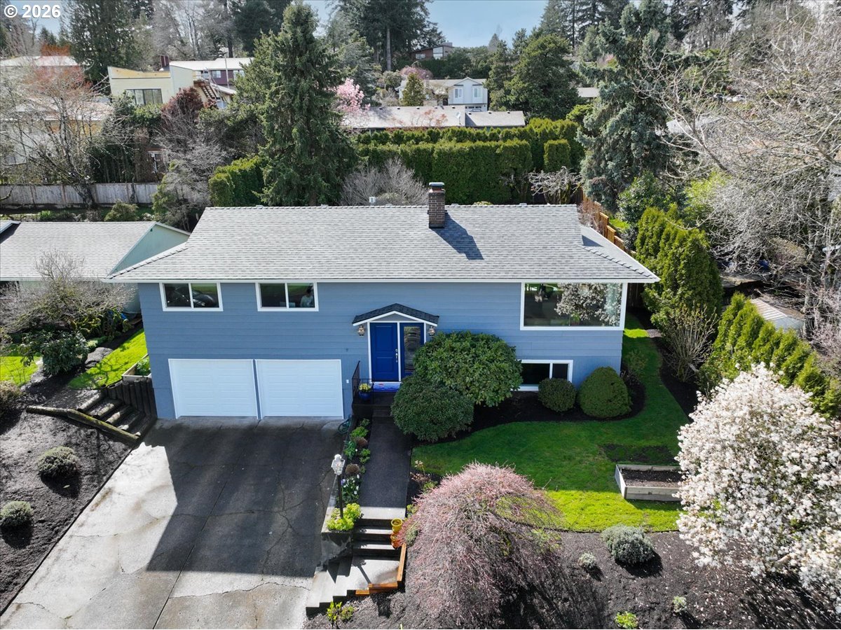 10339 Southwest 40th Avenue Portland, OR 97219 - Photo 2 of 37 a aerial view of a house with garden space and street view