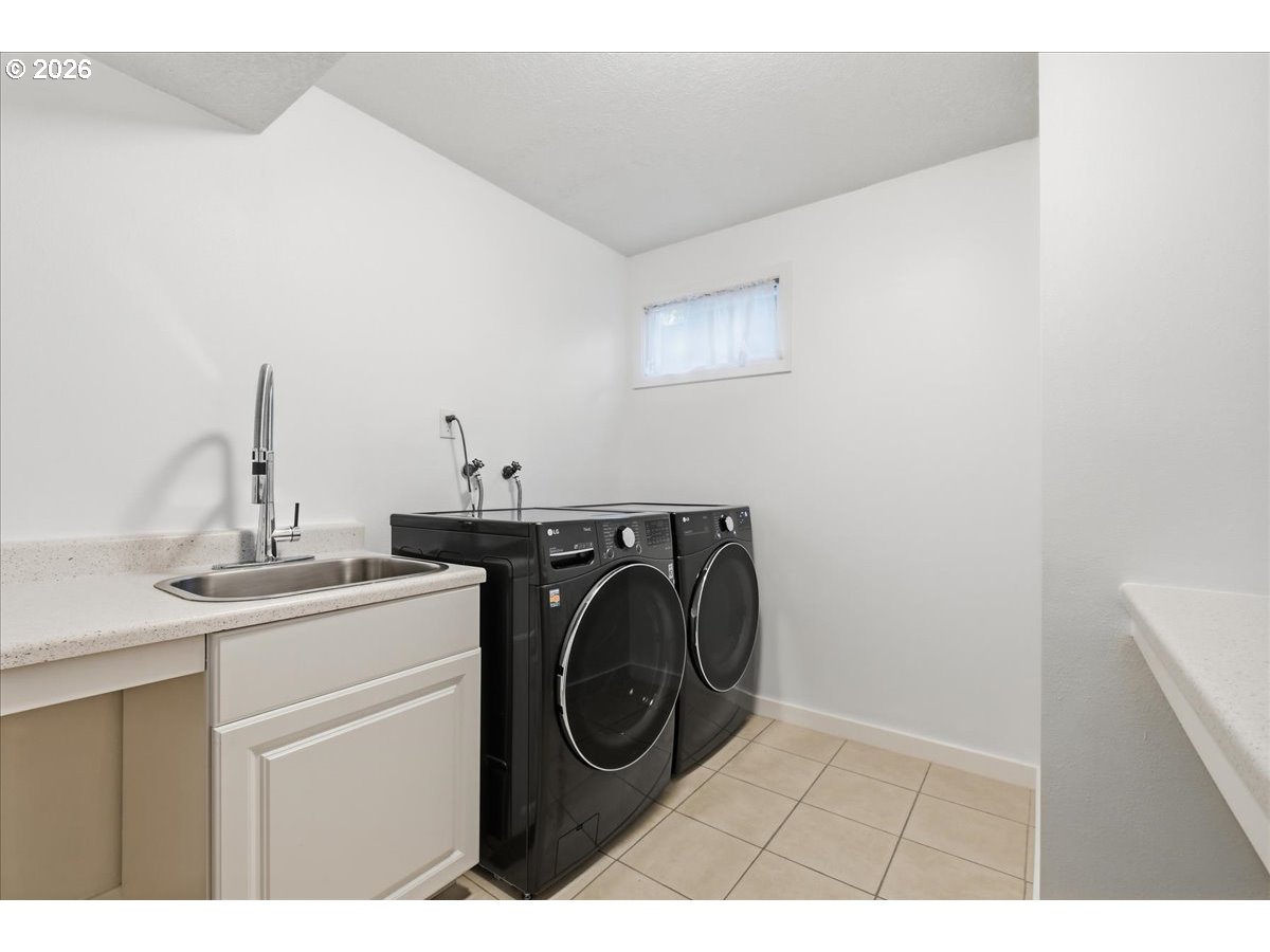 10339 Southwest 40th Avenue Portland, OR 97219 - Photo 27 of 37 a utility room with dryer and washer