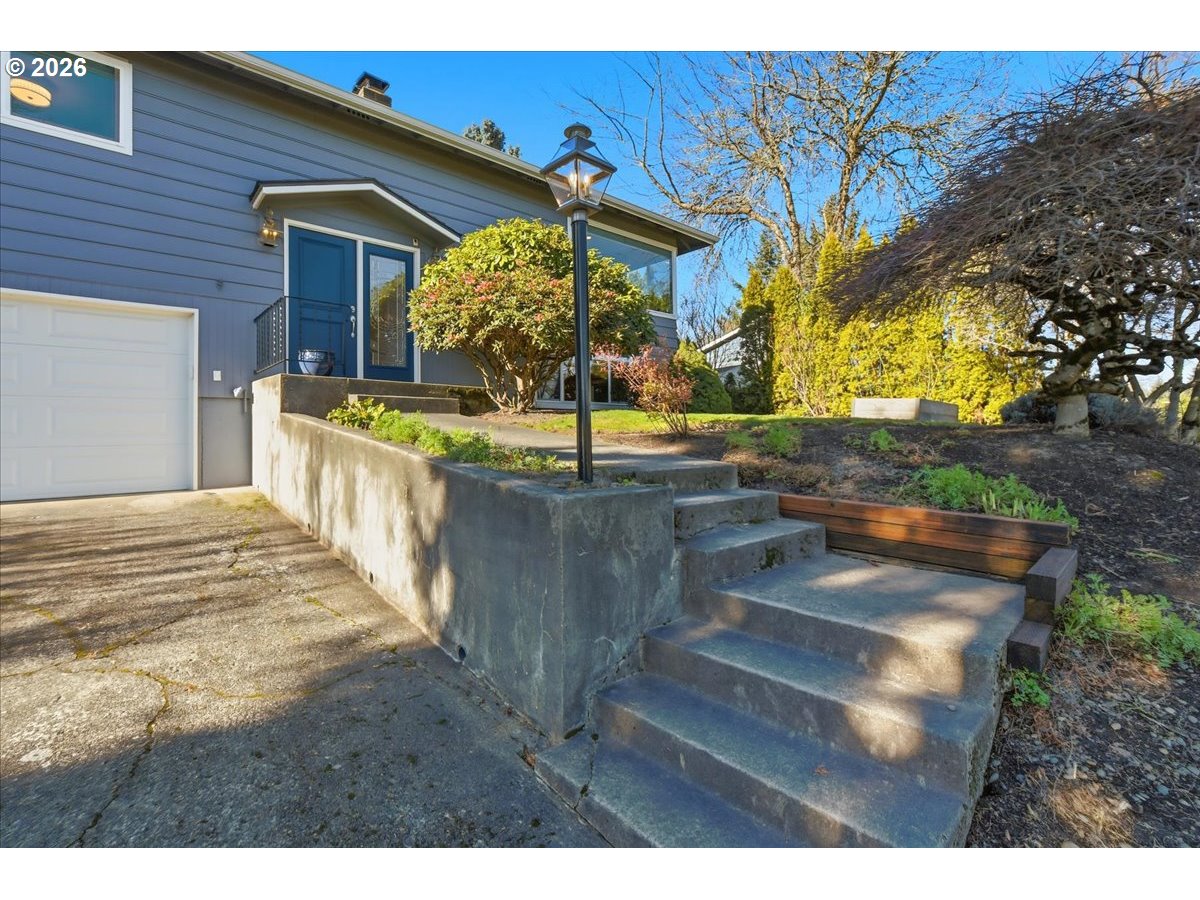 10339 Southwest 40th Avenue Portland, OR 97219 - Photo 3 of 37 a view of a house with a wooden fence