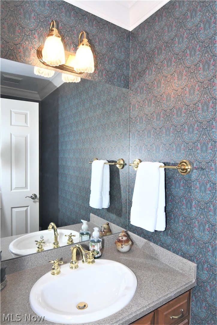 659 Sunridge Road Fairlawn, OH 44333 - Photo 6 of 35 1st floor half bath with Schrock maple cabinetry