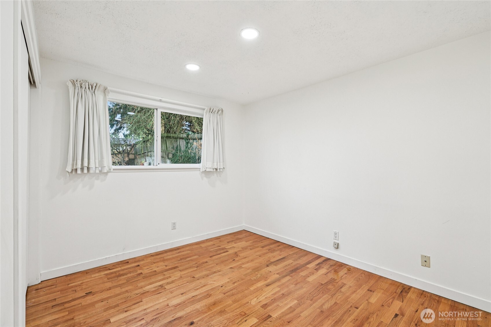 2434 Southwest 328th Street Federal Way, WA 98023 - Photo 14 of 19 a view of empty room with wooden floor and fan