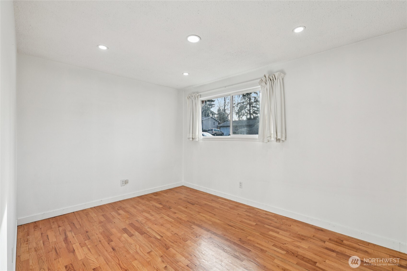 2434 Southwest 328th Street Federal Way, WA 98023 - Photo 15 of 19 a view of empty room with wooden floor