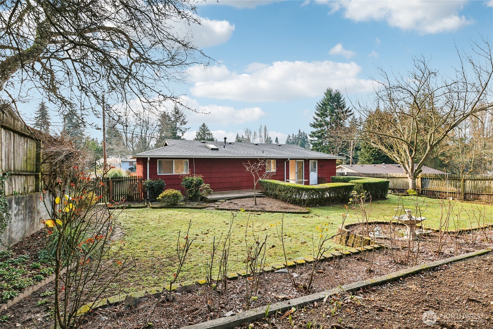2434 Southwest 328th Street Federal Way, WA 98023 - Photo 18 of 19 a view of a house with a yard covered by trees
