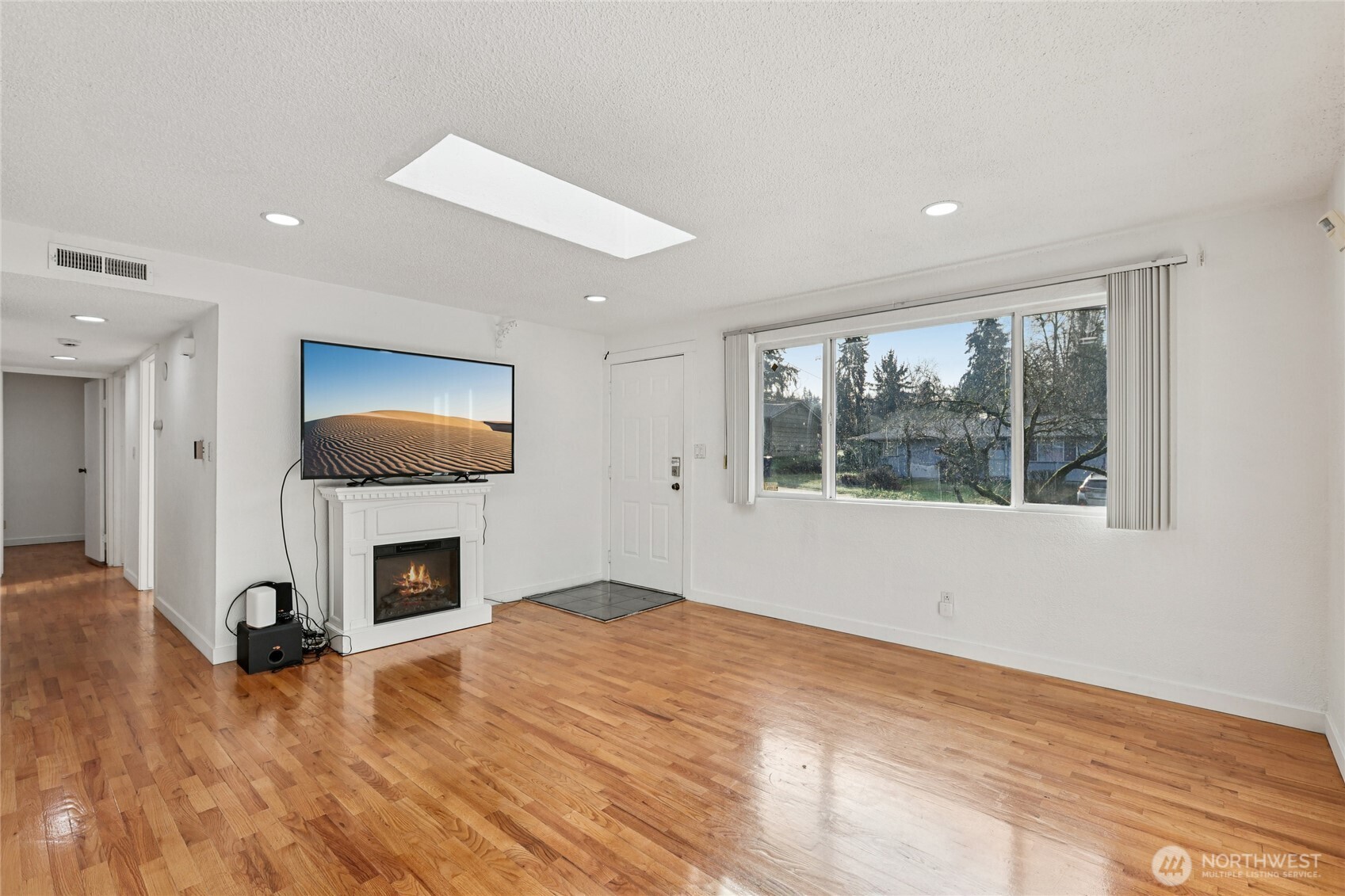 2434 Southwest 328th Street Federal Way, WA 98023 - Photo 3 of 19 a living room with fireplace furniture and a flat screen tv