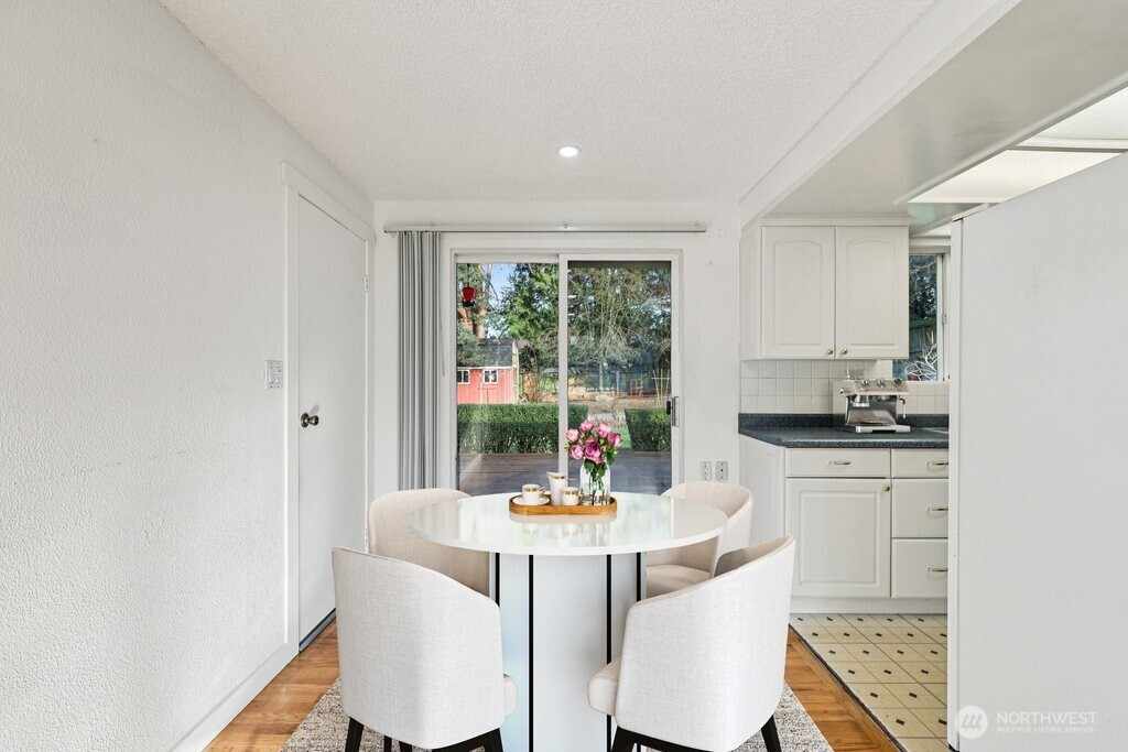2434 Southwest 328th Street Federal Way, WA 98023 - Photo 4 of 19 a kitchen with a table and chairs in it