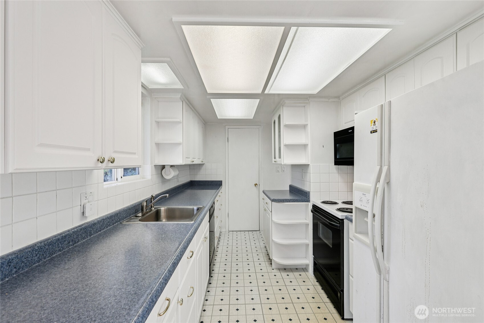 2434 Southwest 328th Street Federal Way, WA 98023 - Photo 5 of 19 a kitchen with a sink stainless steel appliances and counter space