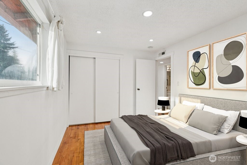 2434 Southwest 328th Street Federal Way, WA 98023 - Photo 9 of 19 a bedroom with a bed and painting on the wall