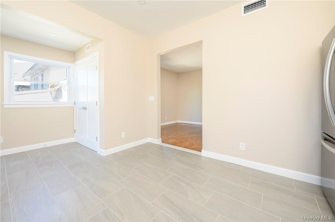 9 Todd Place, Unit 1ST FL RIGHT SIDE Ossining, NY 10562 - Photo 7 of 17 Eat in kitchen with view of the private laundry closet.