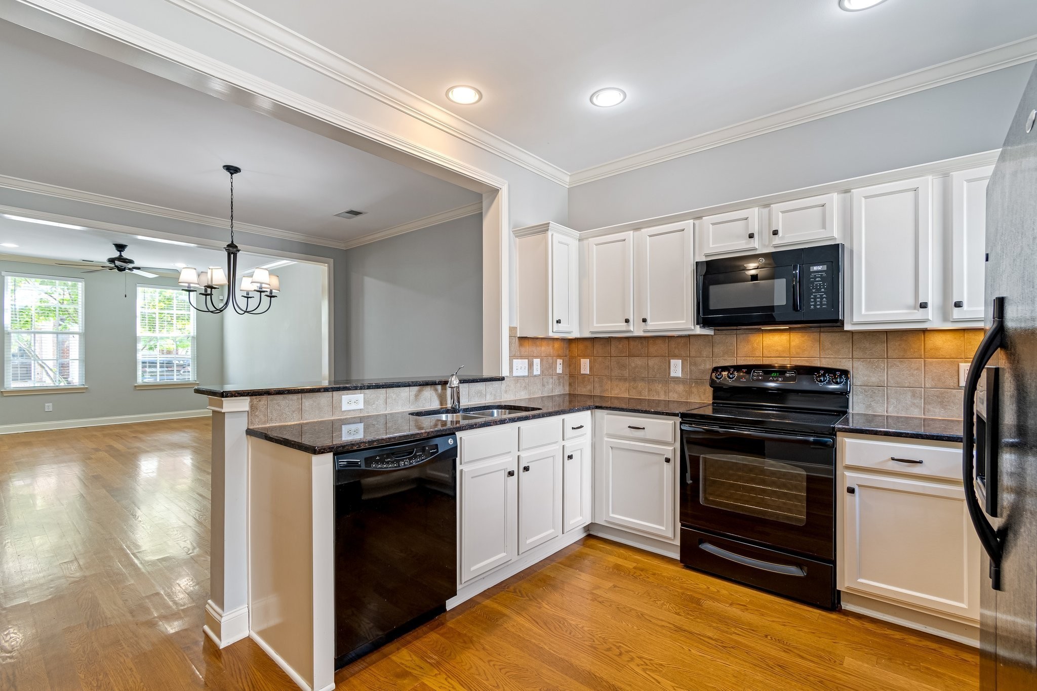318 Byron Way Franklin, TN 37064 - Photo 18 of 53 a kitchen with stainless steel appliances granite countertop a stove and a sink