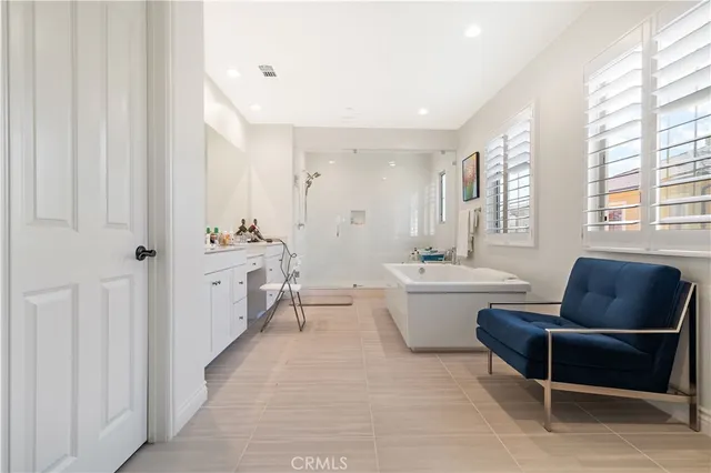 a living room with furniture a table and a window