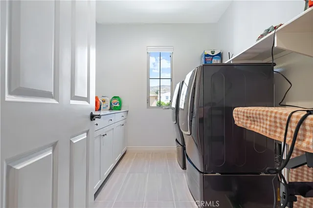 a kitchen with a refrigerator and window