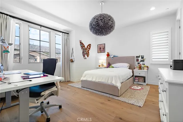 a bedroom with a bed and a table in it