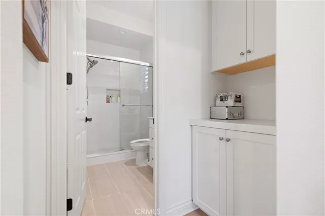 a bathroom with a shower toilet and sink