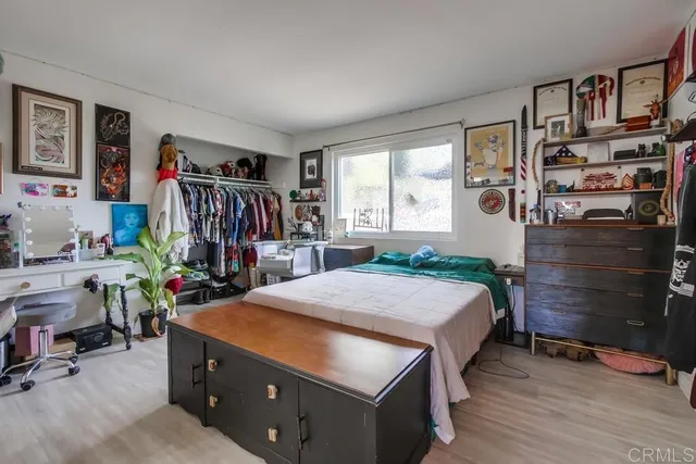 a bed room with a bed and a book shelf