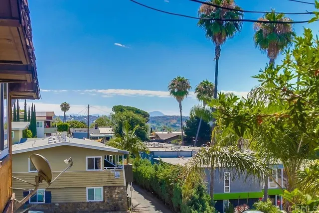 a view of houses with an outdoor space and seating