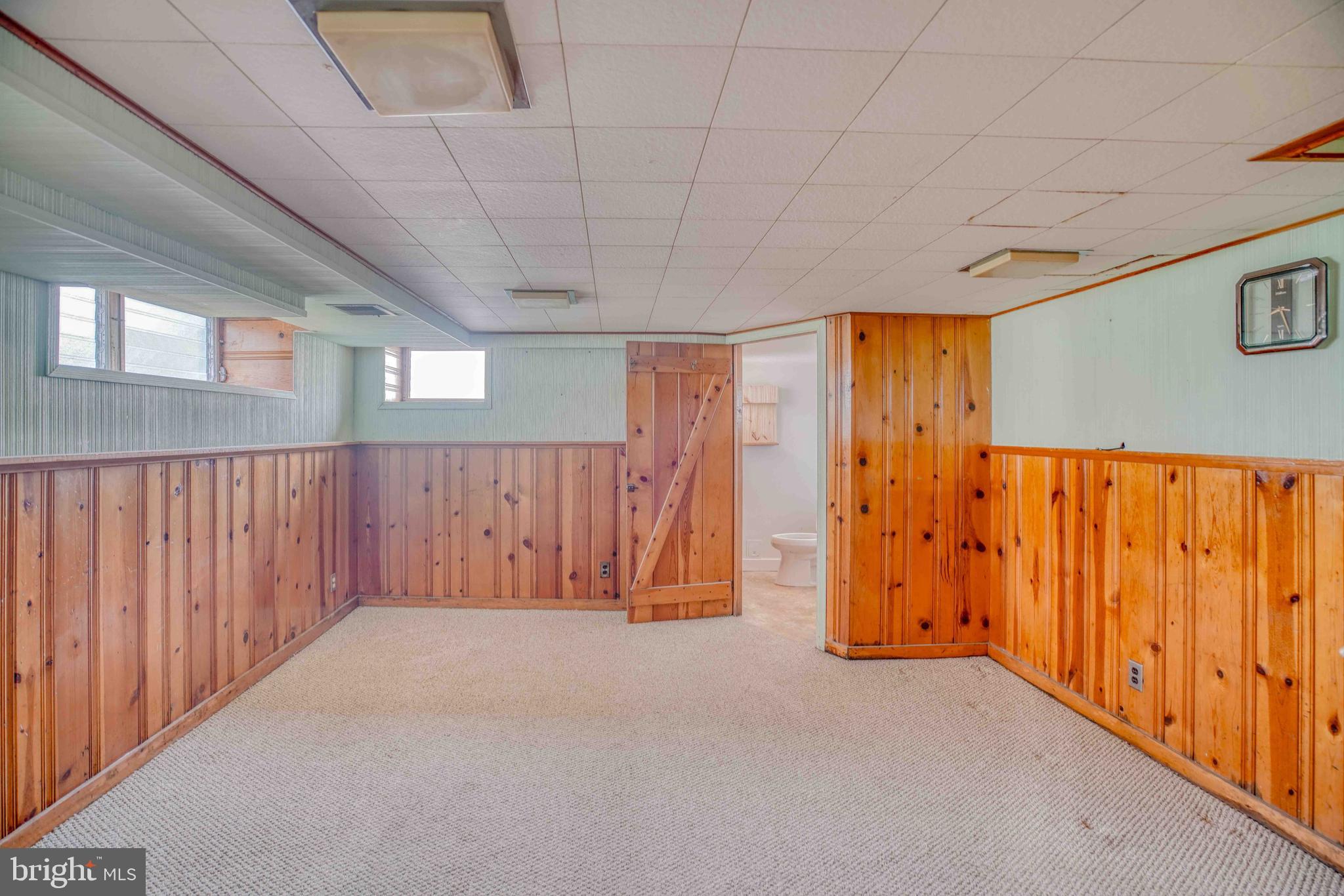 1136 Kerper Street Philadelphia, PA 19111 - Photo 31 of 41 a view of an empty room with wooden walls