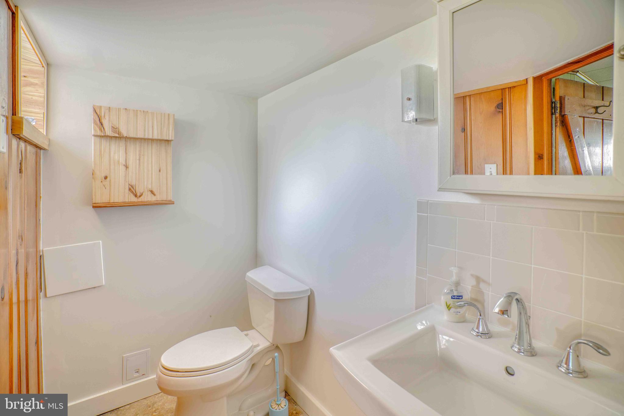 1136 Kerper Street Philadelphia, PA 19111 - Photo 33 of 41 a white toilet sitting next to a bathroom sink