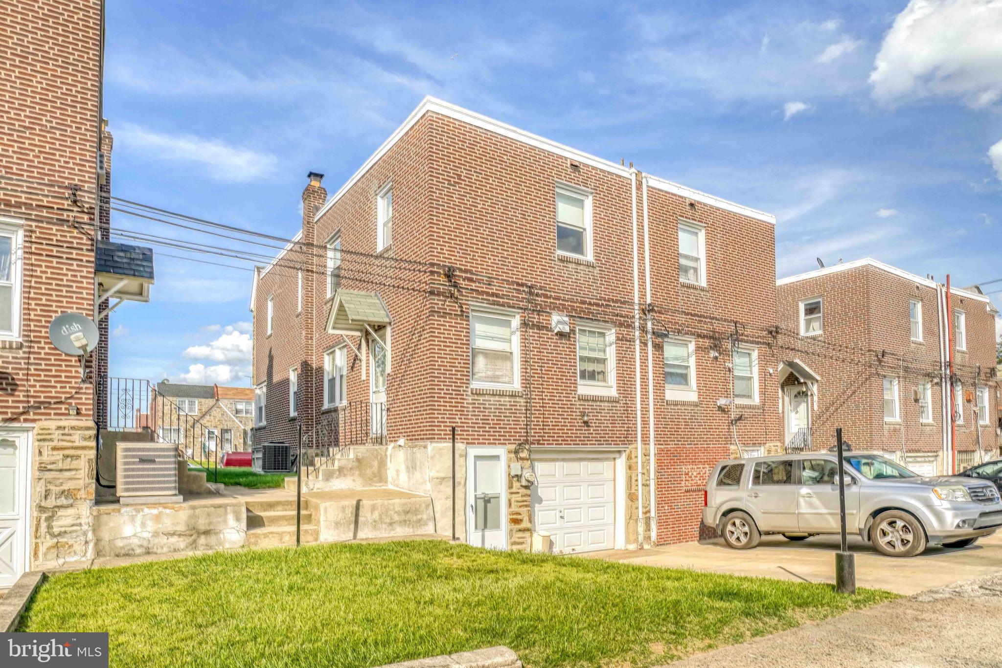 1136 Kerper Street Philadelphia, PA 19111 - Photo 6 of 41 a front view of a house with a yard