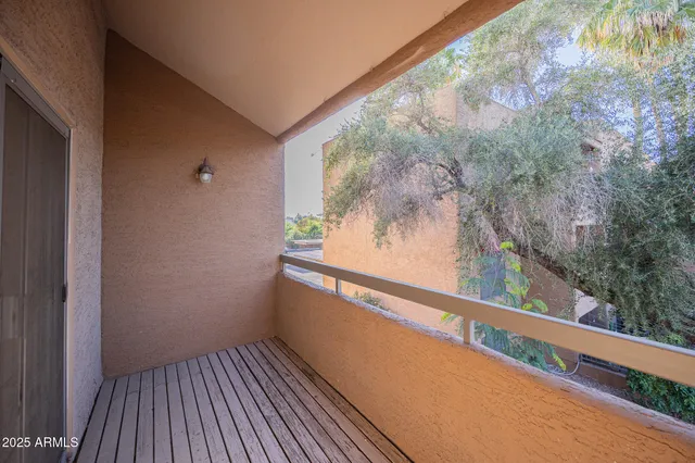 a view of a bathroom from a glass door