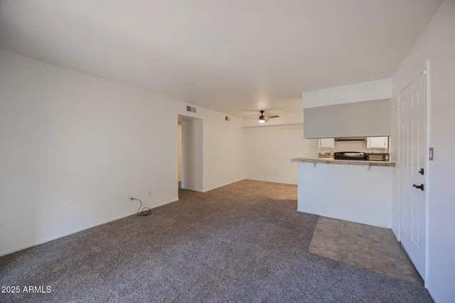 a kitchen with a refrigerator and a sink