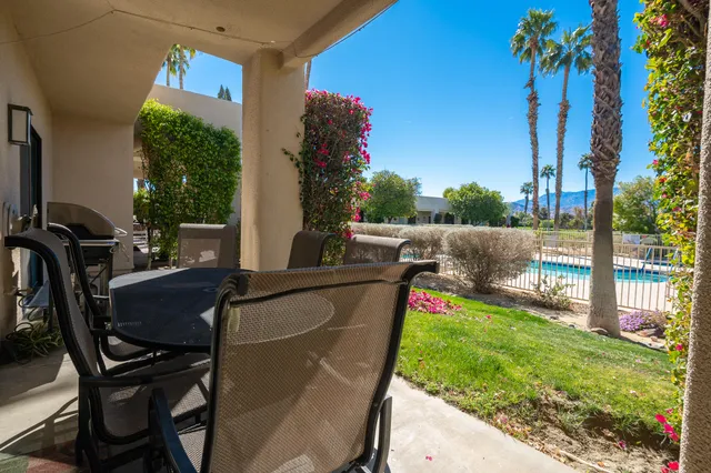 a view of a chairs and table in the patio