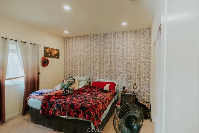 a bedroom with a bed and a closet