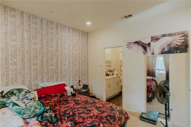 a bathroom with a sink mirror and vanity