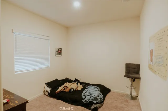 an aerial view of multiple houses with a city view