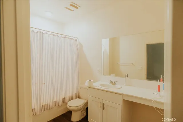 an aerial view of a residential houses with city view