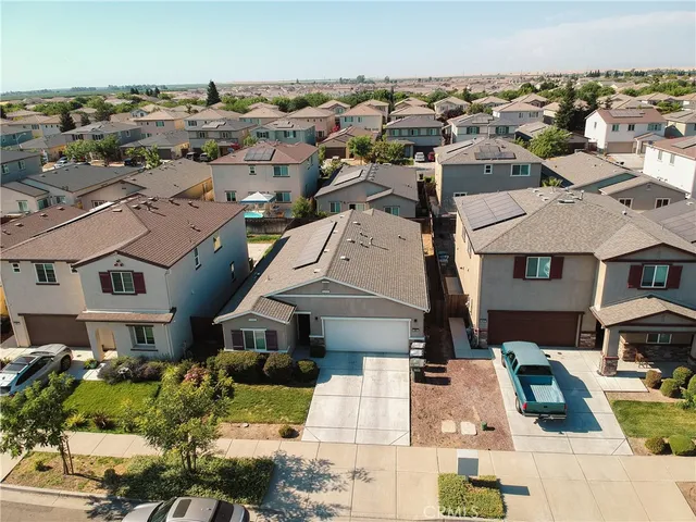 an aerial view of a house with outdoor space