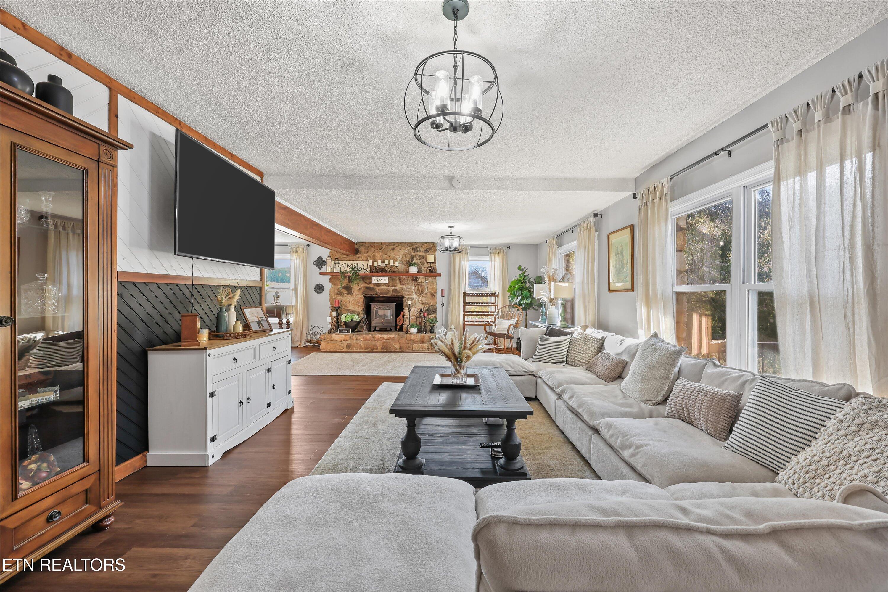 7969 Glendale Community Road Greenback, TN 37742 - Photo 11 of 56 Living room opens to family room