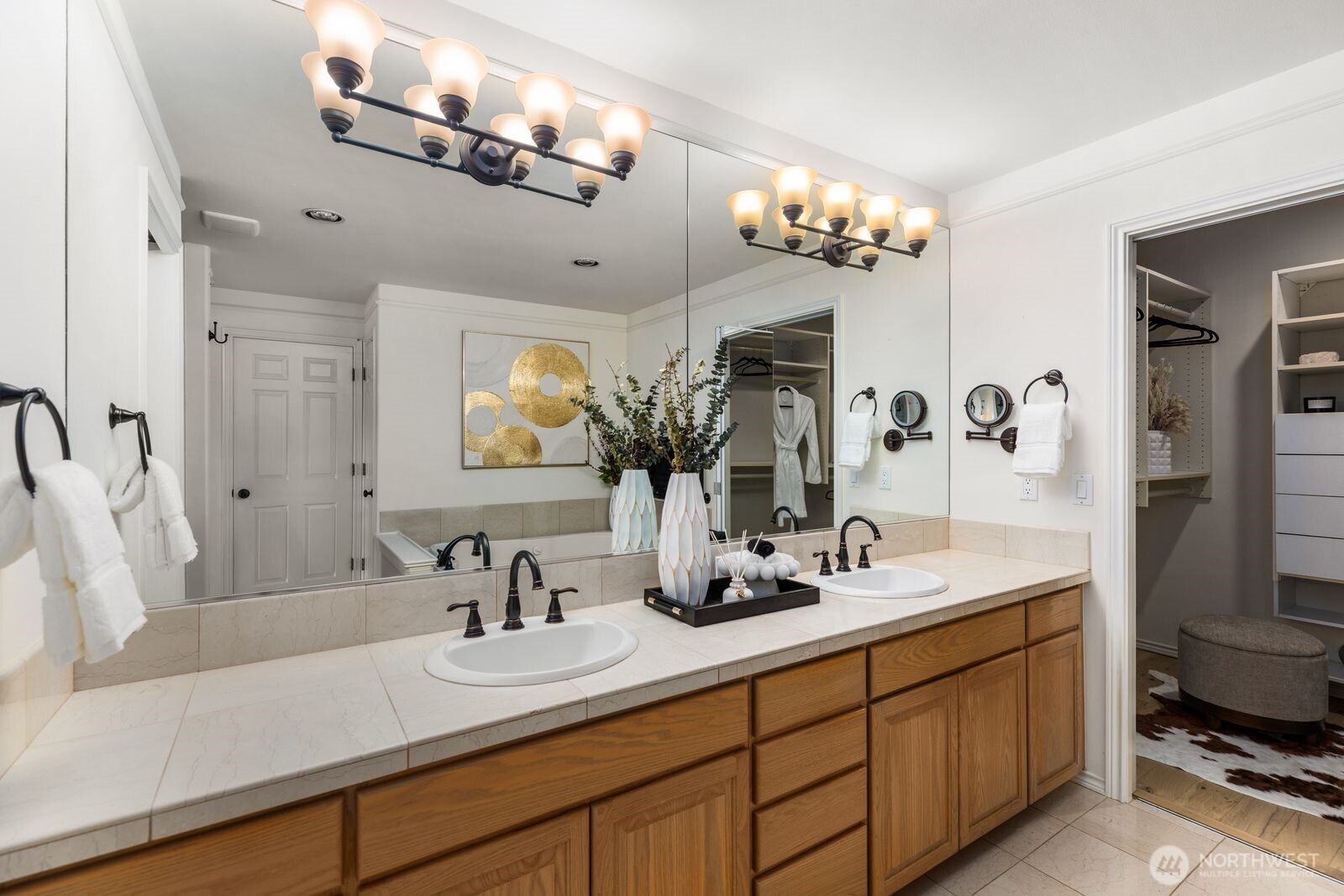 2349 Harbor Avenue Southwest, Unit 701 Seattle, WA 98126 - Photo 24 of 39 a bathroom with a double vanity sink mirror and chandelier