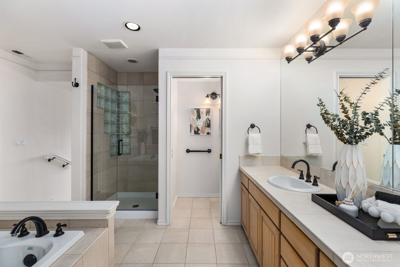 2349 Harbor Avenue Southwest, Unit 701 Seattle, WA 98126 - Photo 26 of 39 a bathroom with a sink a toilet and shower