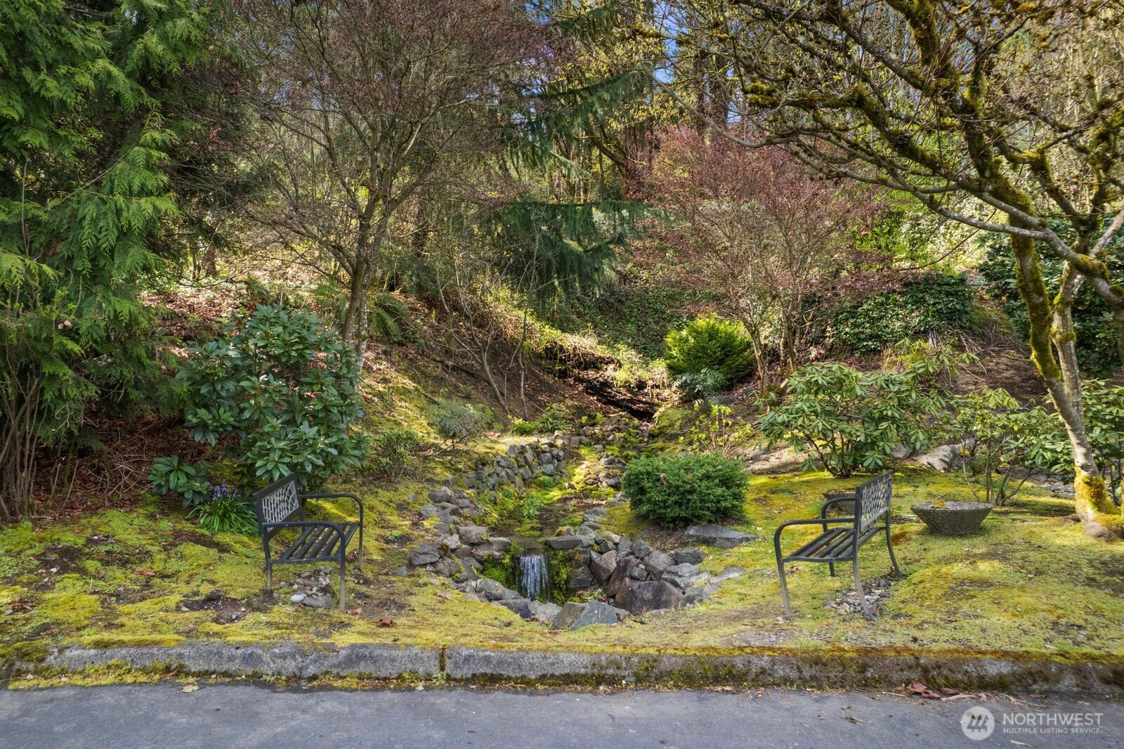 2349 Harbor Avenue Southwest, Unit 701 Seattle, WA 98126 - Photo 39 of 39 a backyard of a house with a yard and outdoor seating