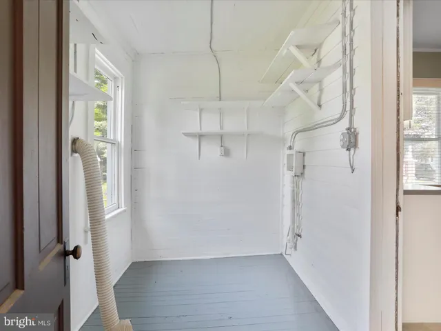 a view of a hallway with a white walls
