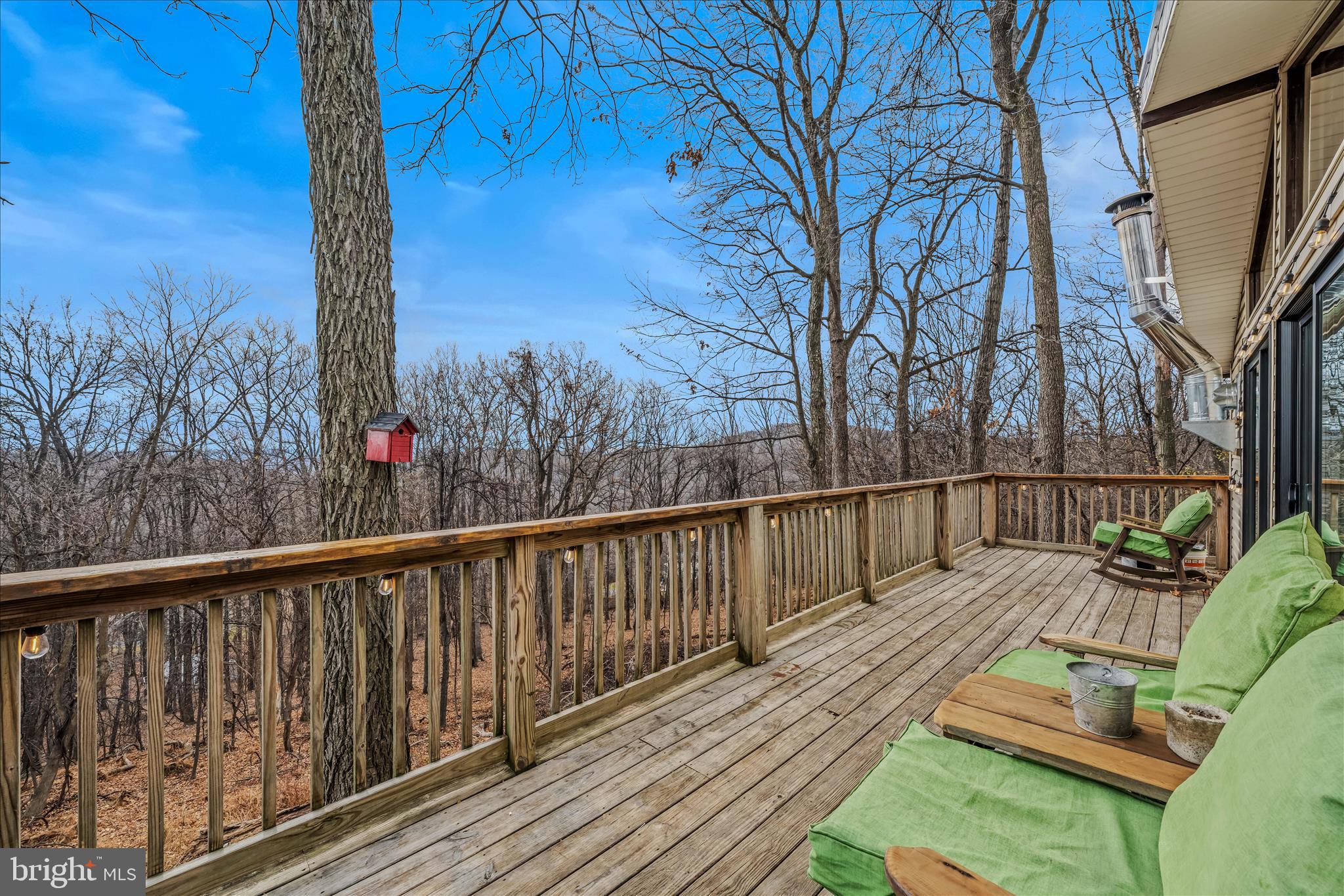 384 Trapper Ridge Lane Hedgesville, WV 25427 - Photo 11 of 52 a view of balcony with wooden floor and outdoor seating