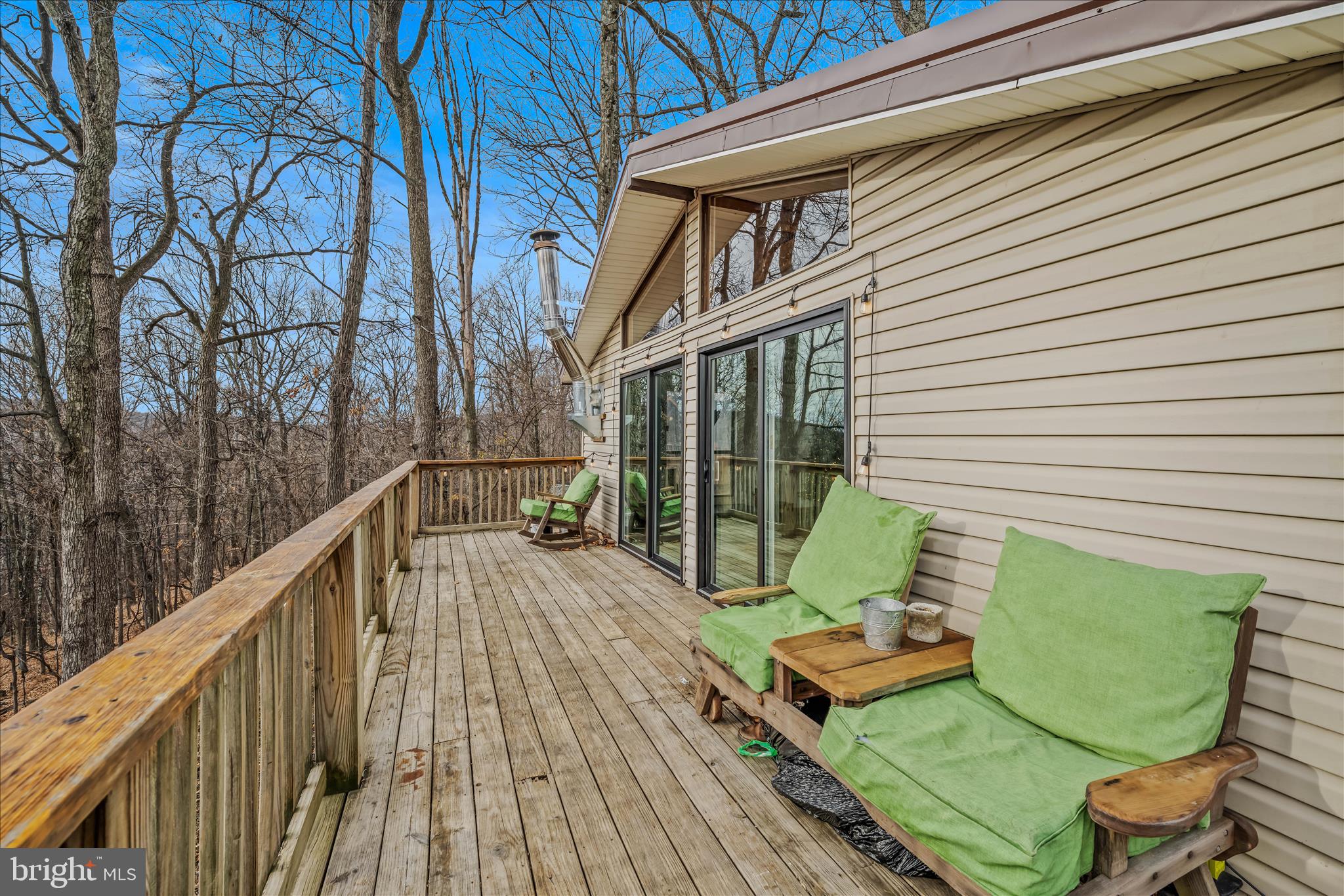 384 Trapper Ridge Lane Hedgesville, WV 25427 - Photo 12 of 52 a view of a chair and tables in the balcony