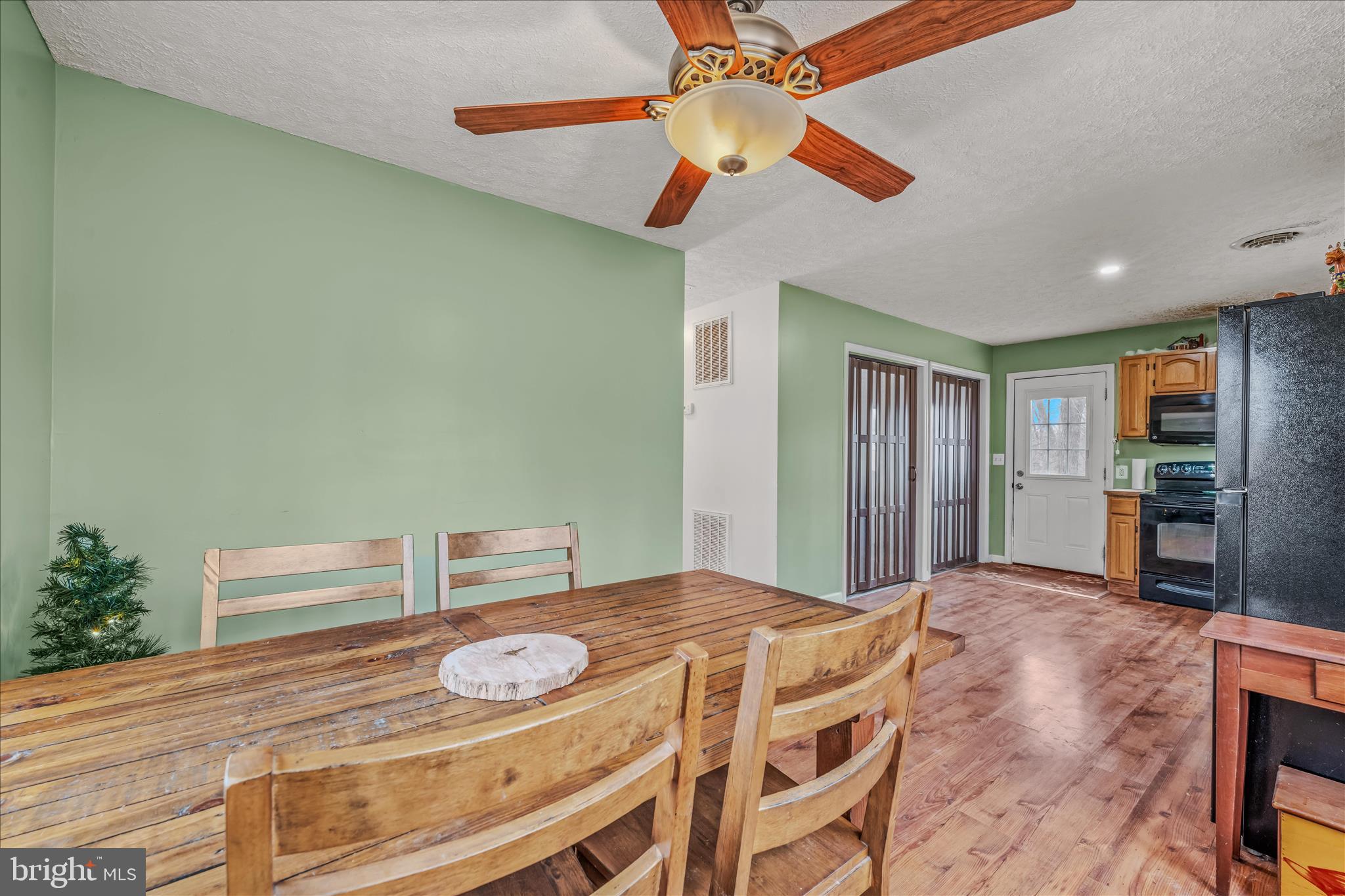 384 Trapper Ridge Lane Hedgesville, WV 25427 - Photo 18 of 52 a bedroom with a bed and a chandelier